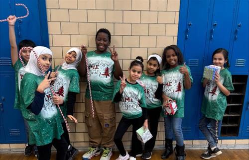 students posing with candy canes